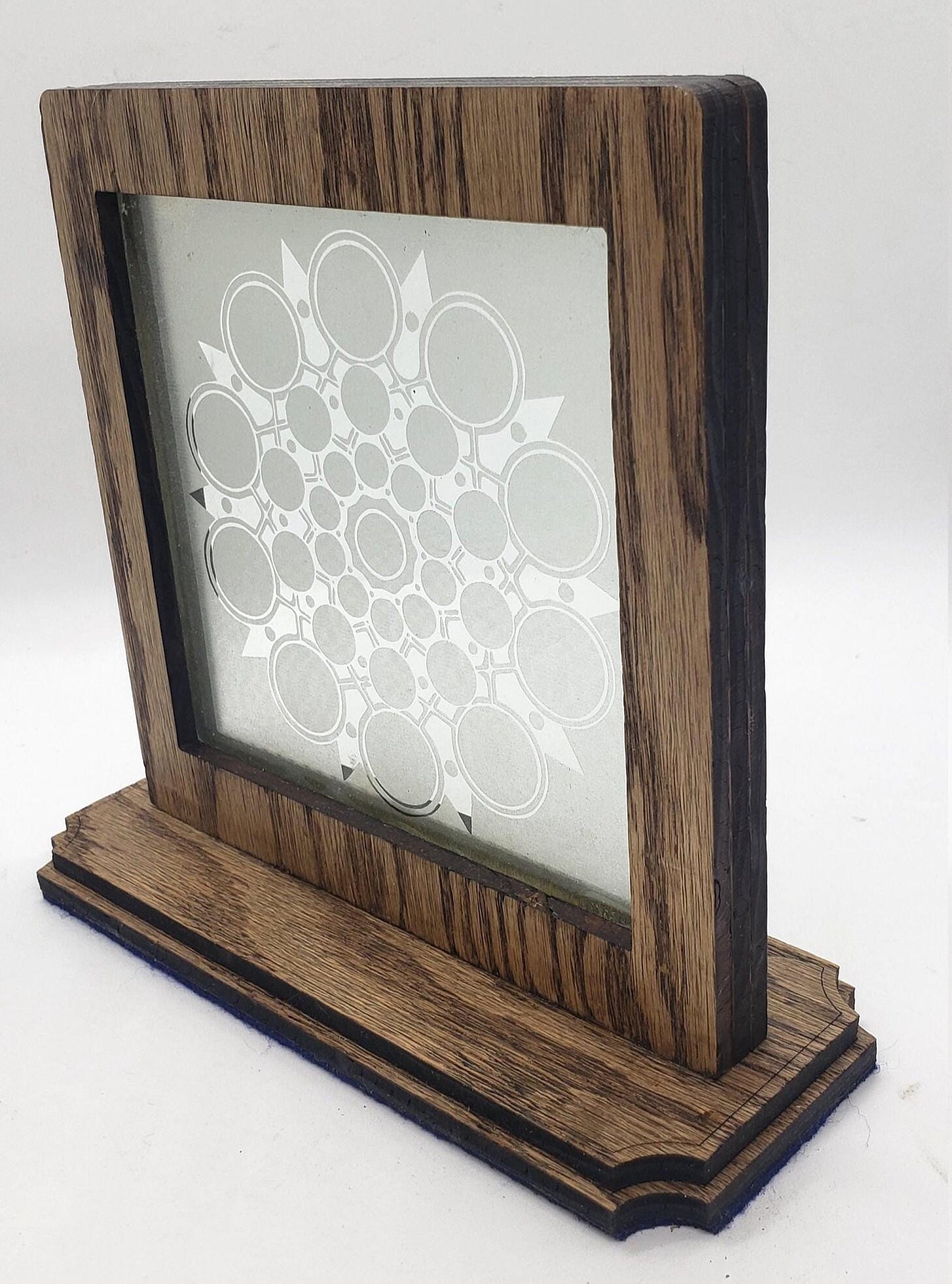 This unique abstract laser etching on a mirror creates captivating, modern art. The intricate design transforms into a stunning focal point.