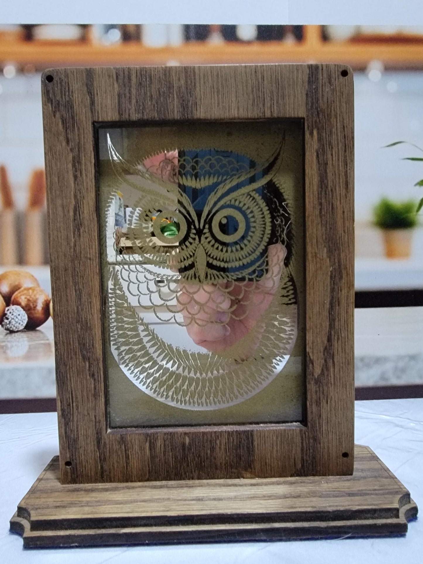 Laser Etched Owl Mirror: Oak Wood Frame, Gold Accents. An oak-framed mirror with owl engraving, compact, elegant, made from fireplace relic.