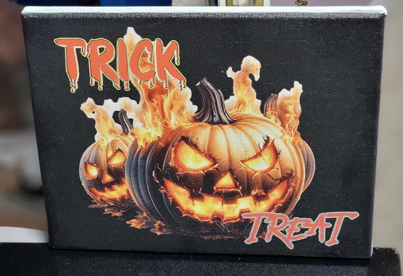 Trick or Treat” 8x10 Canvas—fiery jack-o'-lanterns & bold UV print bring Halloween heat to your décor. Spooky charm, delivered! Scary