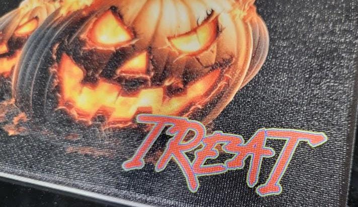 Trick or Treat” 8x10 Canvas—fiery jack-o'-lanterns & bold UV print bring Halloween heat to your décor. Spooky charm, delivered! Scary