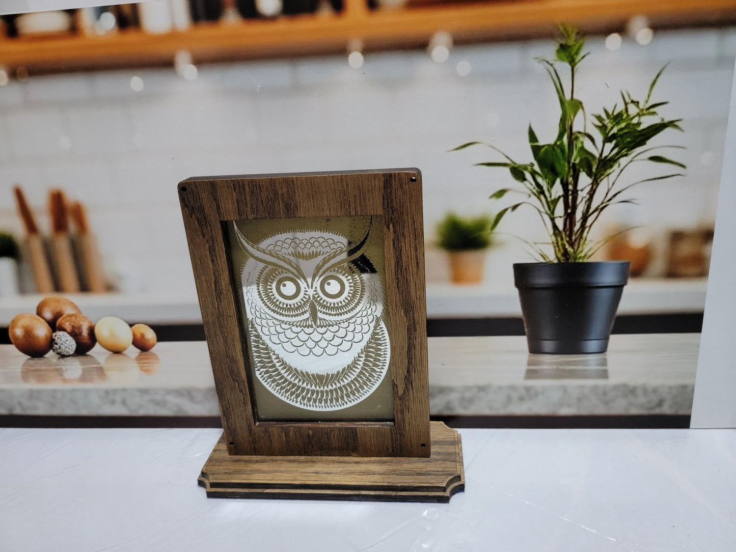 Laser Etched Owl Mirror: Oak Wood Frame, Gold Accents. An oak-framed mirror with owl engraving, compact, elegant, made from fireplace relic.
