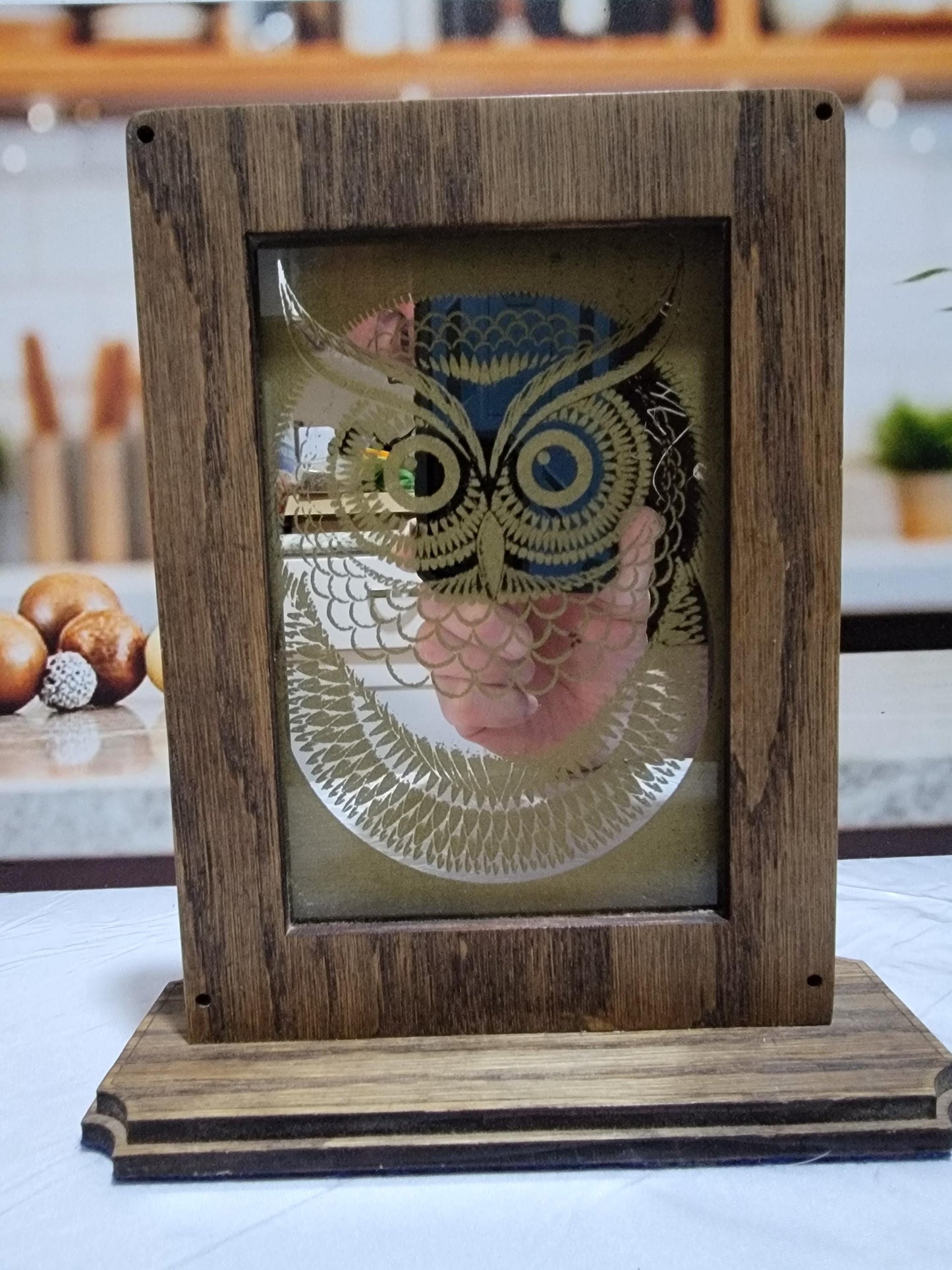 Laser Etched Owl Mirror: Oak Wood Frame, Gold Accents. An oak-framed mirror with owl engraving, compact, elegant, made from fireplace relic.