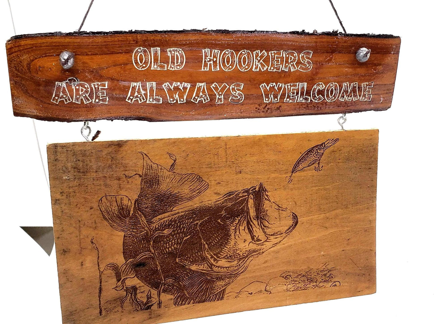 This is a funny sign that would look great on the front door of a cabin or a lakeside bar. It features the words "Old Hookers Welcome"!