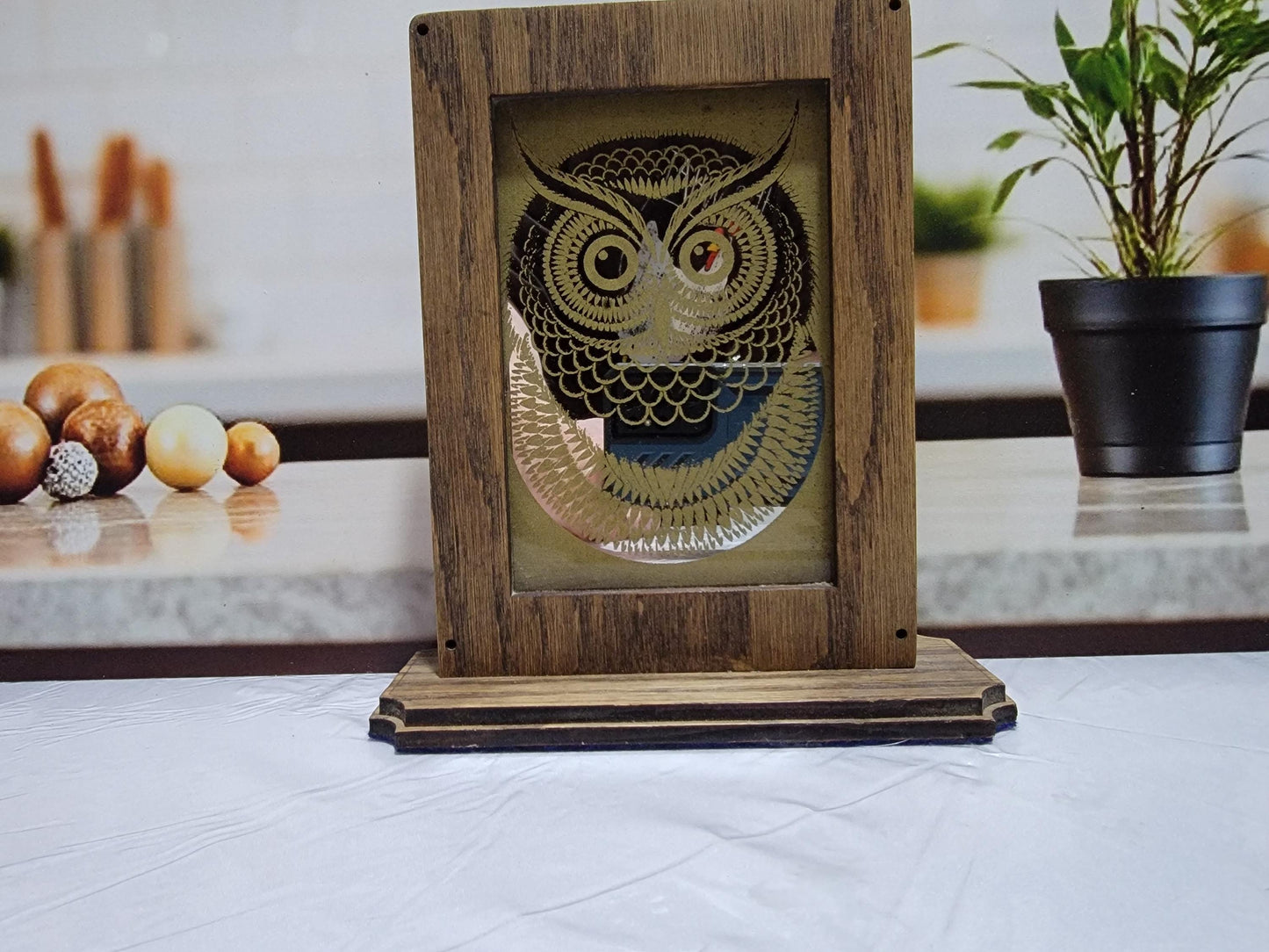 Laser Etched Owl Mirror: Oak Wood Frame, Gold Accents. An oak-framed mirror with owl engraving, compact, elegant, made from fireplace relic.