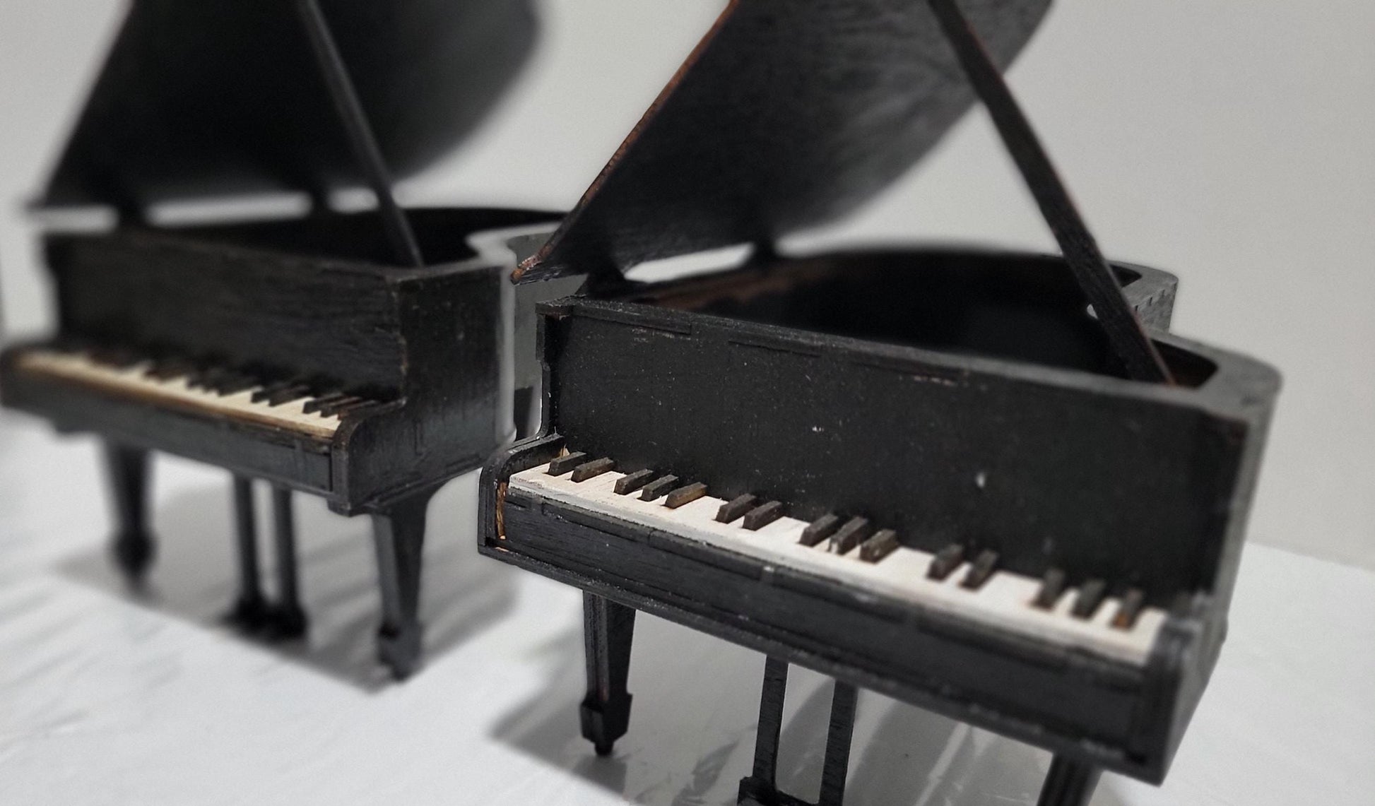 Don’t Miss This One-of-a-Kind Heirloom for Music Lovers
This isn’t just a gift — it’s a showstopper. A handcrafted miniature grand piano jewelry box that captures the soul of a concert hall in the palm of your hand. Designed for those who cherish music, memory, and craftsmanship, this piece is as rare as it is refined.
Meticulously made from solid MDF wood and sealed in a rich matte black finish, it features lifelike piano keys, pedals, and a hinged lid that opens to reveal a hidden jewelry compartment. 