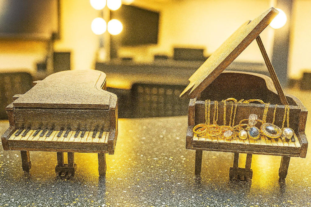 Looking for a distinctive gift for a pianist or music lover? This handcrafted jewelry box is a miniature replica of a classical grand piano — elegant, functional, and full of charm.
Made from solid MDF wood and finished in matte black with a thick polyurethane seal, it features realistic details: piano keys, pedals, and a lid that opens to reveal a jewelry compartment. We’ve reinforced the legs and foot pedals for added stability, and offer a double-thick lid option to prevent warping over time.