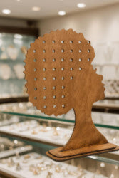 This stunning wooden silhouette is perfect as a tabletop display. Ideal for showcasing earrings, tying headwraps, or creating custom wreaths, it adds a touch of bold elegance to any space.