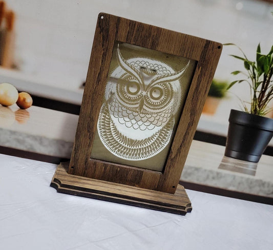 Laser Etched Owl Mirror: Oak Wood Frame, Gold Accents. An oak-framed mirror with owl engraving, compact, elegant, made from fireplace relic.