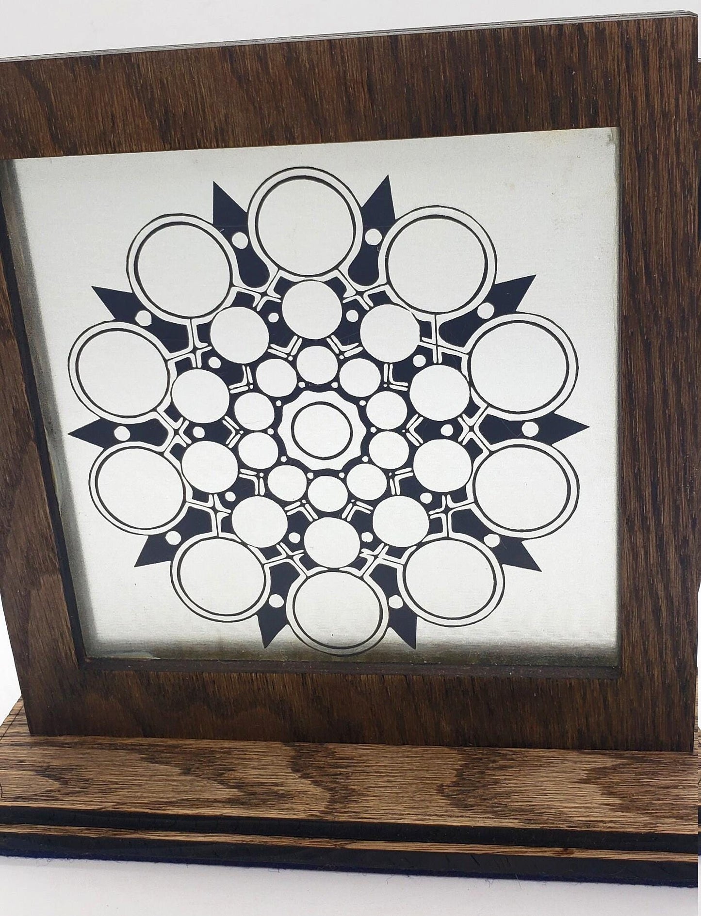 This unique abstract laser etching on a mirror creates captivating, modern art. The intricate design transforms into a stunning focal point.