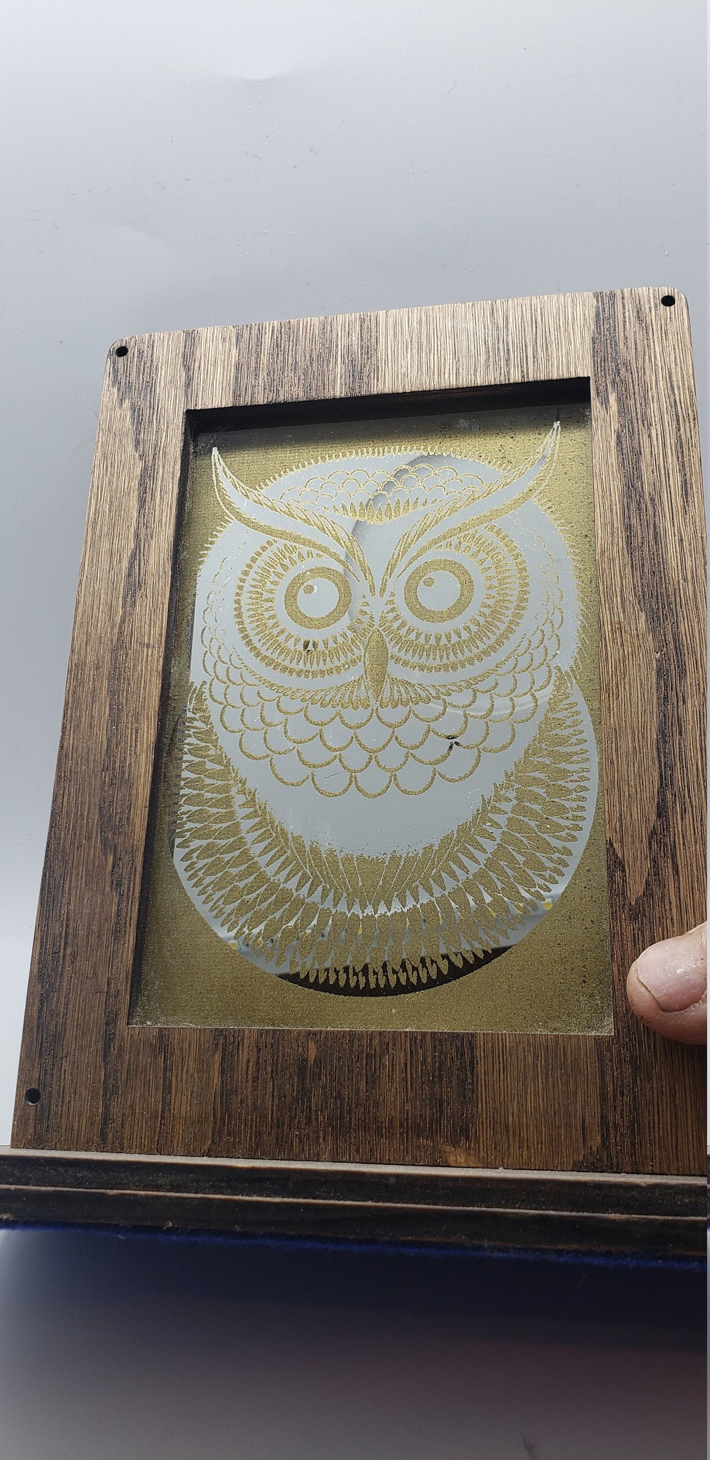 Laser Etched Owl Mirror: Oak Wood Frame, Gold Accents. An oak-framed mirror with owl engraving, compact, elegant, made from fireplace relic.