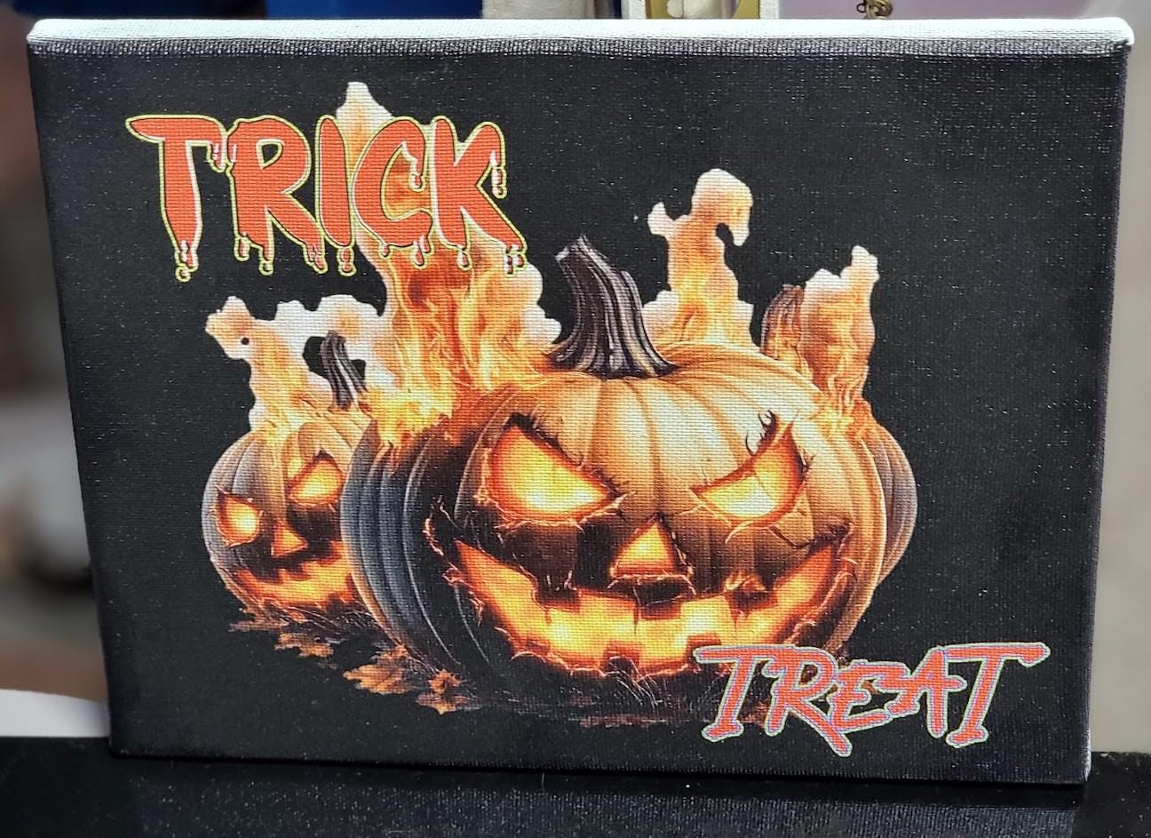Trick or Treat” 8x10 Canvas—fiery jack-o'-lanterns & bold UV print bring Halloween heat to your décor. Spooky charm, delivered! Scary