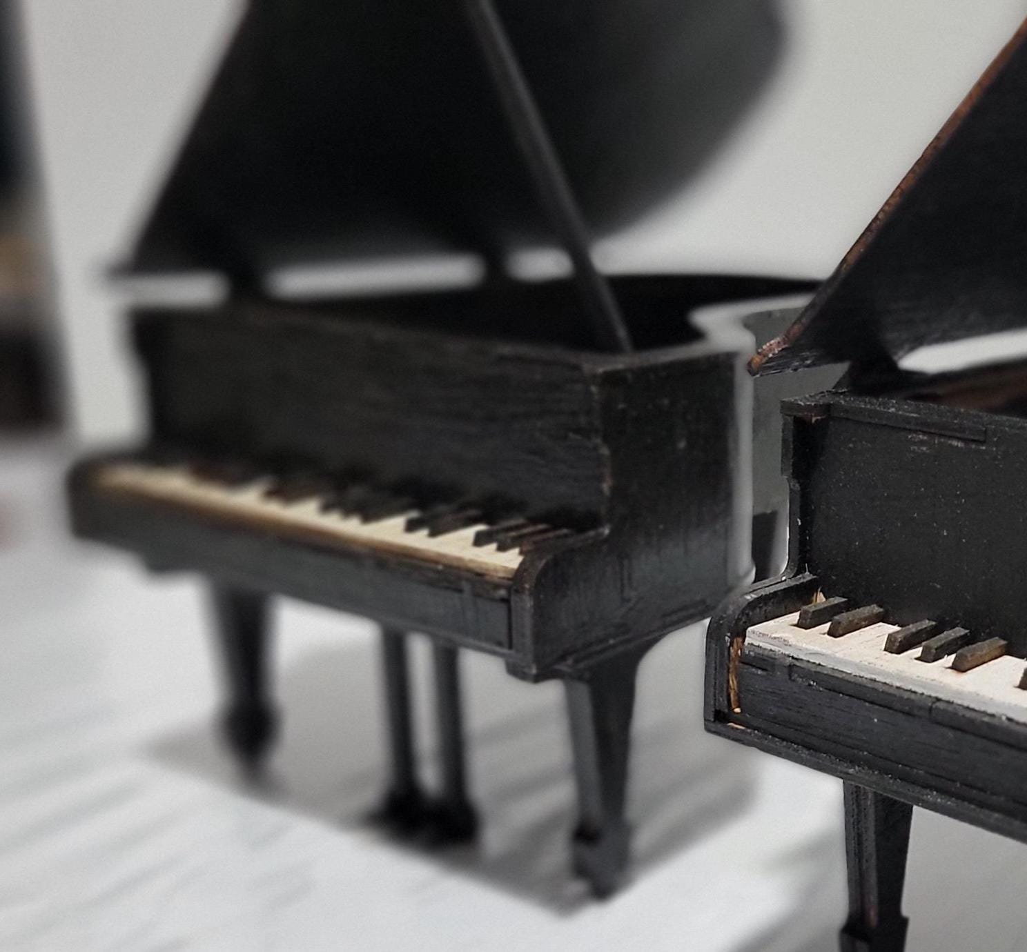 Don’t Miss This One-of-a-Kind Heirloom for Music Lovers
This isn’t just a gift — it’s a showstopper. A handcrafted miniature grand piano jewelry box that captures the soul of a concert hall in the palm of your hand. Designed for those who cherish music, memory, and craftsmanship, this piece is as rare as it is refined.
Meticulously made from solid MDF wood and sealed in a rich matte black finish, it features lifelike piano keys, pedals, and a hinged lid that opens to reveal a hidden jewelry compartment. 